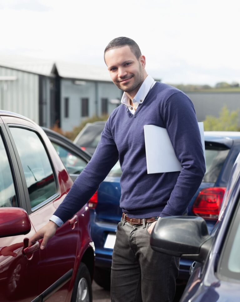 man-holding-car-handle-while-holding-file (1) (1)
